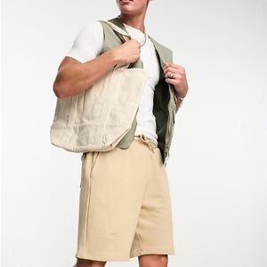 ASOS DESIGN oversized jersey mid length shorts in beige